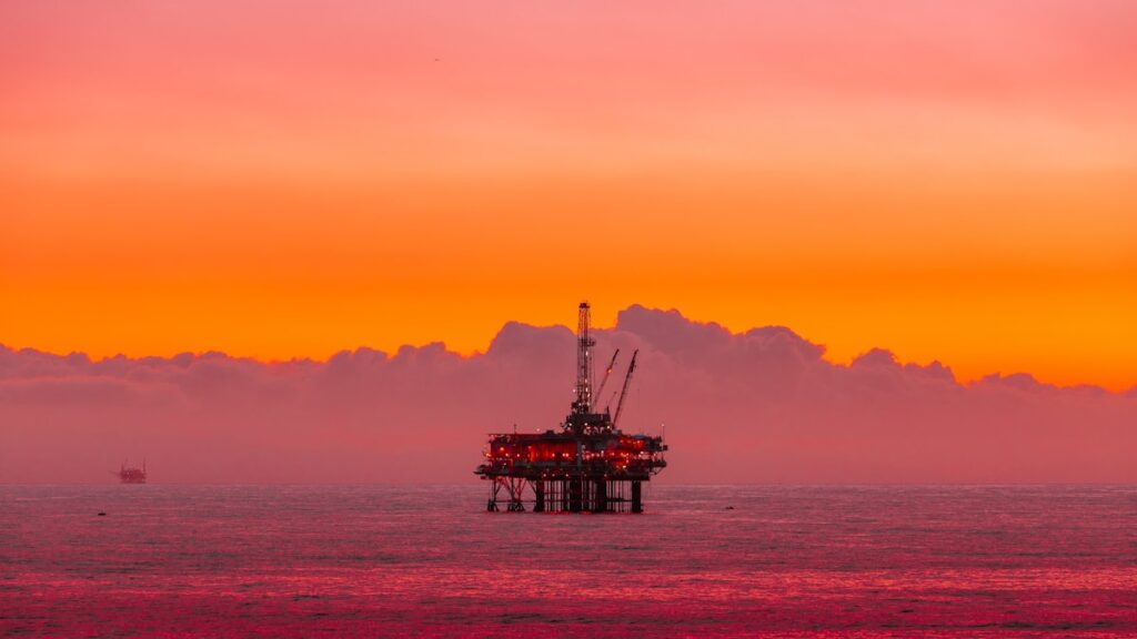 Offshore drilling rig at sea during sunset North Sea